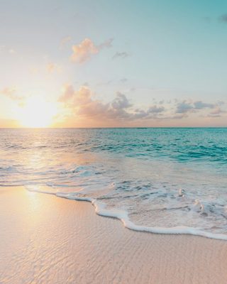 Gentle waves on a beach at golden hour