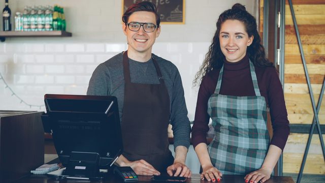 Two café owners at their counter