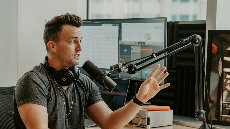 A business owner recording a voice note